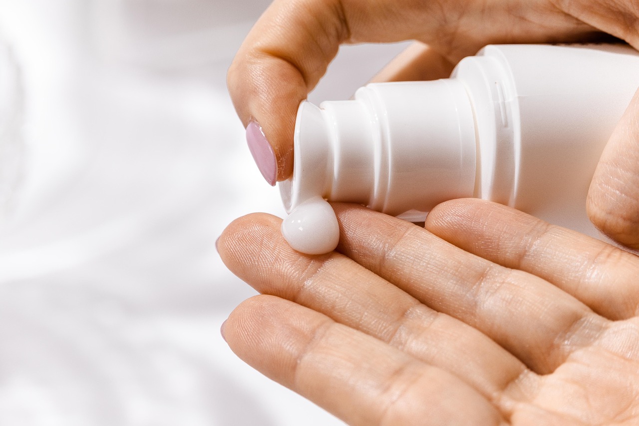 Skincare bottles and jars on a tray