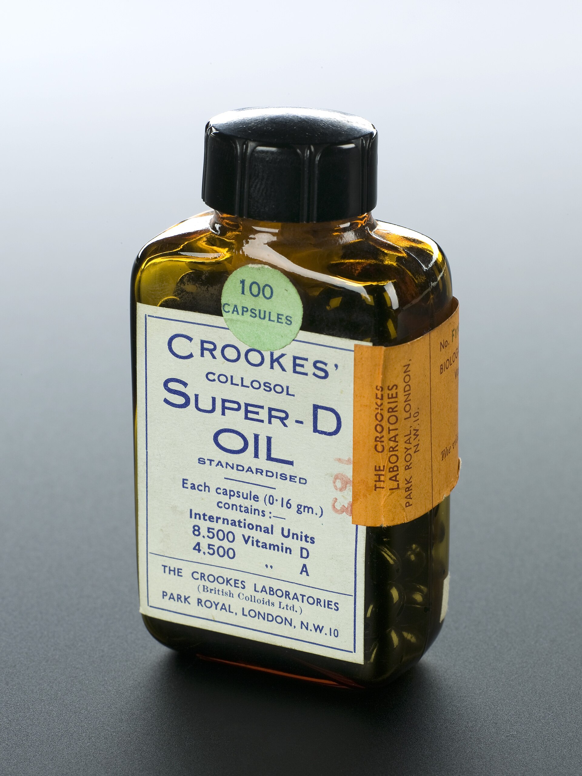 Bottle of oil capsules on a studio ground